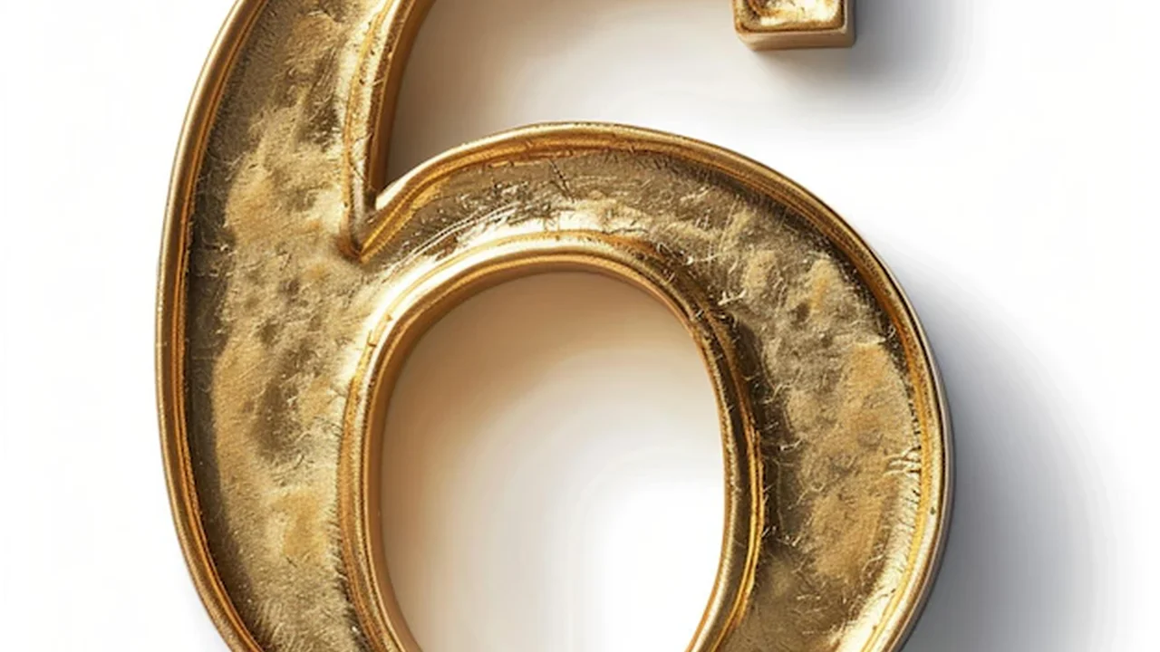 Close up on a plate of mashed potatoes, topped with baked pork chops with cream of mushroom soup, and a side of green beans.