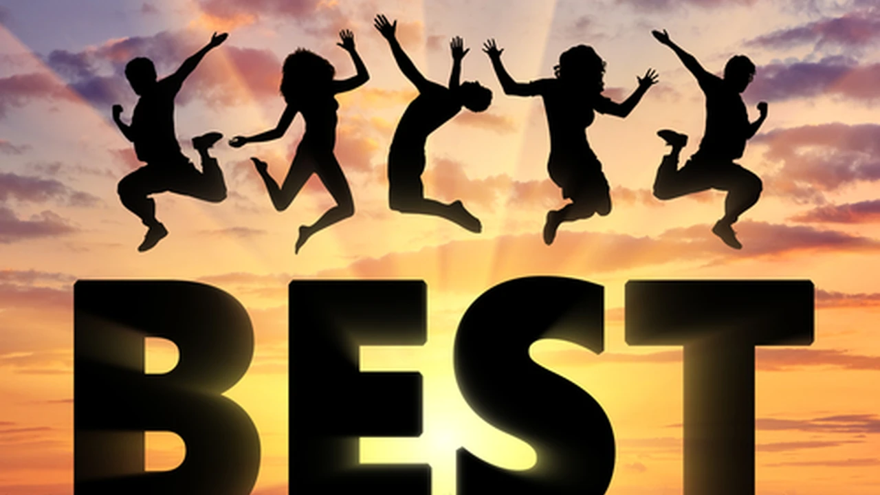 Close up on a plate of mashed potatoes, topped with baked pork chops with cream of mushroom soup, and a side of green beans.