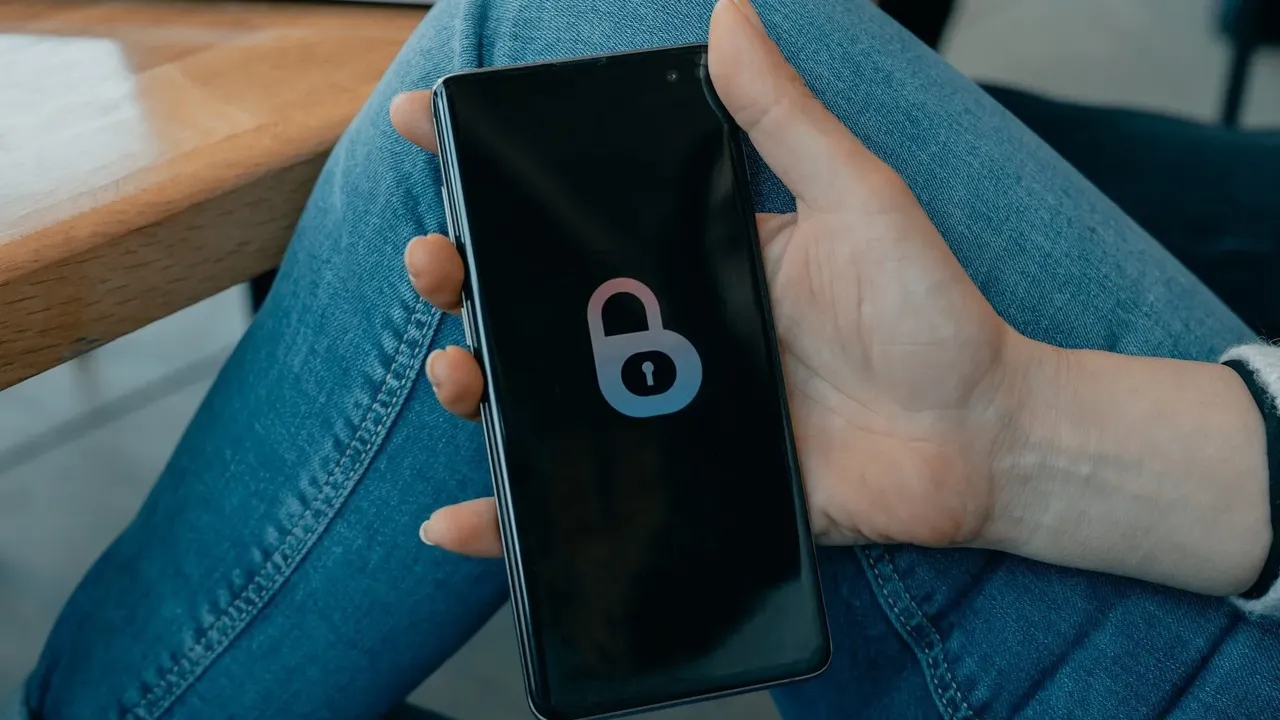Close up on a plate of mashed potatoes, topped with baked pork chops with cream of mushroom soup, and a side of green beans.