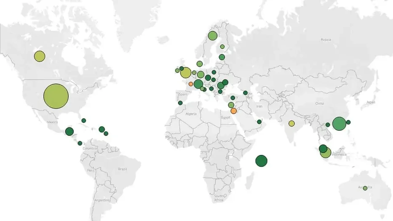 Close up on a plate of mashed potatoes, topped with baked pork chops with cream of mushroom soup, and a side of green beans.