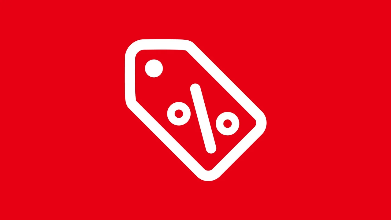 Close up on a plate of mashed potatoes, topped with baked pork chops with cream of mushroom soup, and a side of green beans.